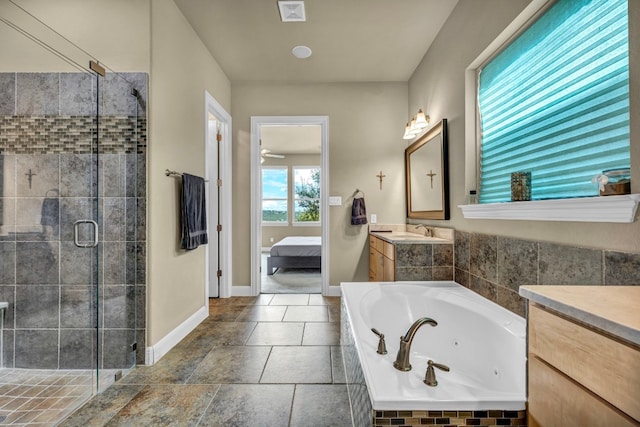 bathroom with vanity, ceiling fan, and independent shower and bath