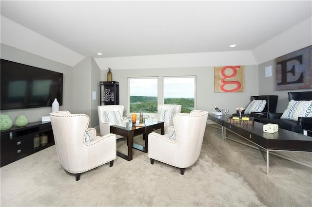 carpeted living room with vaulted ceiling