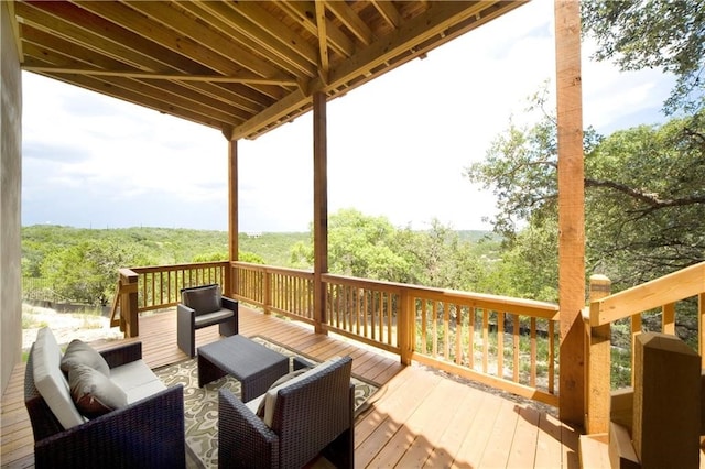 wooden terrace with outdoor lounge area