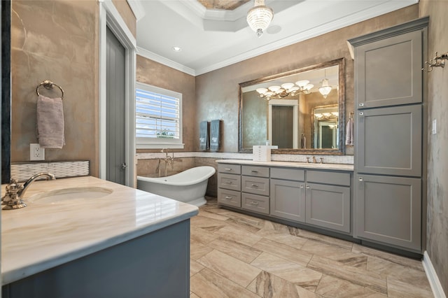 bathroom featuring a tub to relax in, vanity, crown molding, and a raised ceiling