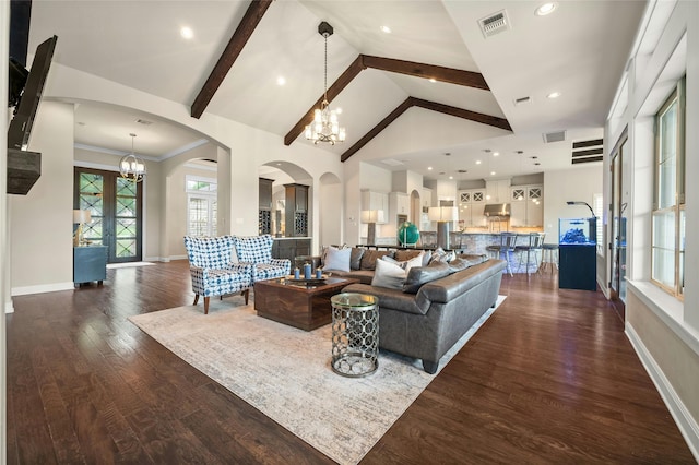 living room featuring high vaulted ceiling, dark hardwood / wood-style flooring, beamed ceiling, and a chandelier