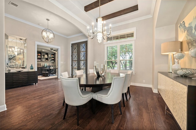 dining area with dark wood-type flooring, a chandelier, and crown molding