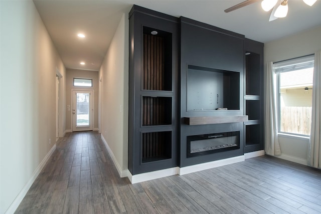 interior space with hardwood / wood-style flooring and built in features