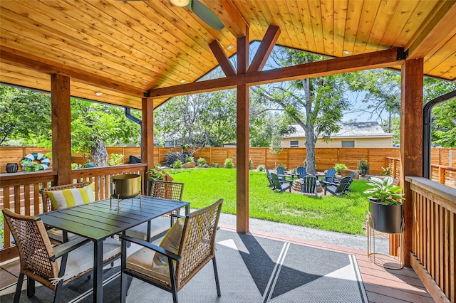 exterior space featuring wooden ceiling, lofted ceiling, and ceiling fan