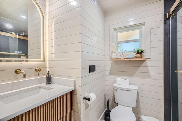 bathroom with toilet and vanity