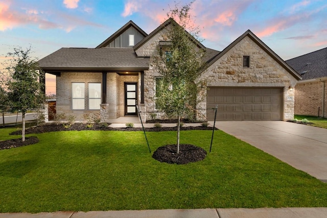 204 Camille St, Leander, TX 78641 - view of front facade featuring stone siding, concrete driveway, a garage, and a front yard