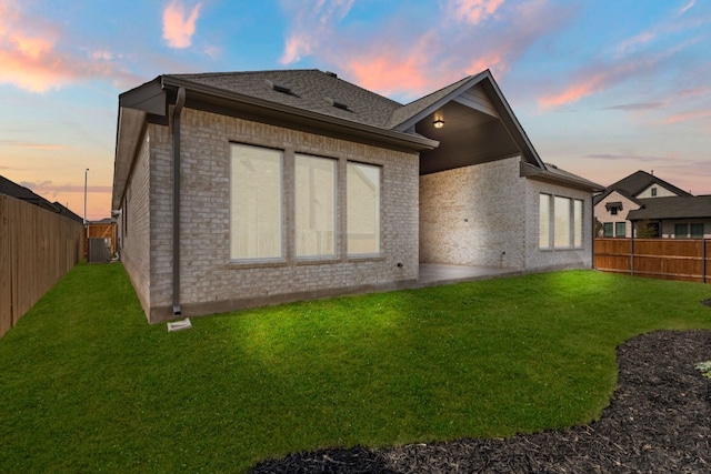 204 Camille St, Leander, TX 78641 - rear view of house featuring brick siding, cooling unit, and roof with shingles