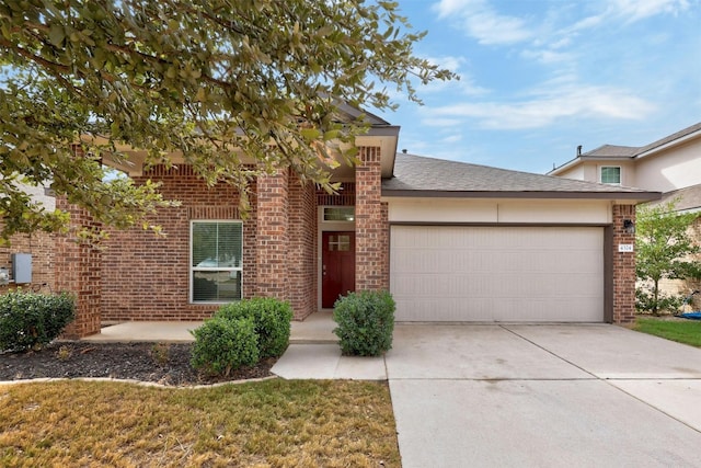 view of front of property with a front lawn and a garage