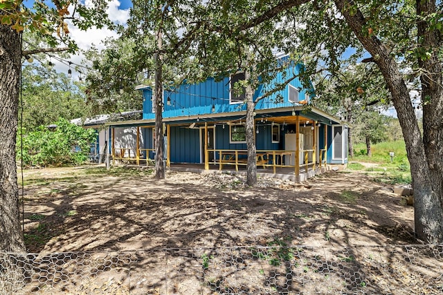 back of property with an outbuilding