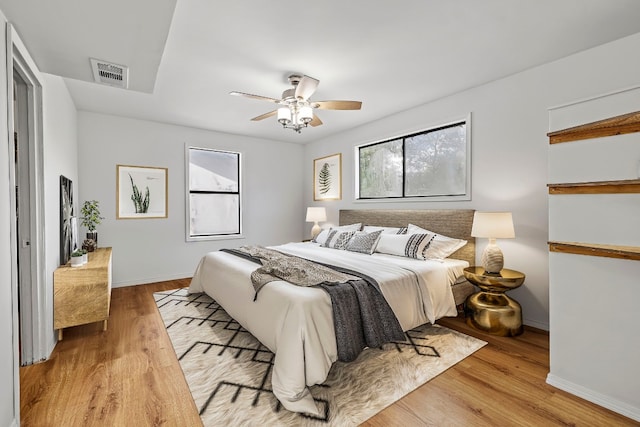 bedroom featuring light hardwood / wood-style flooring and ceiling fan