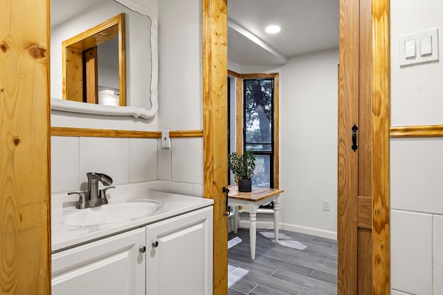 bathroom featuring wood-type flooring and vanity