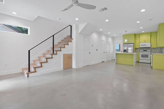 unfurnished living room with baseboards, finished concrete floors, visible vents, and recessed lighting