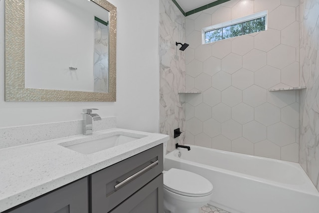 bathroom with shower / bathing tub combination, vanity, and toilet