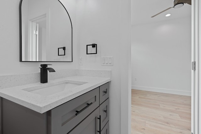 bathroom featuring vanity and hardwood / wood-style floors