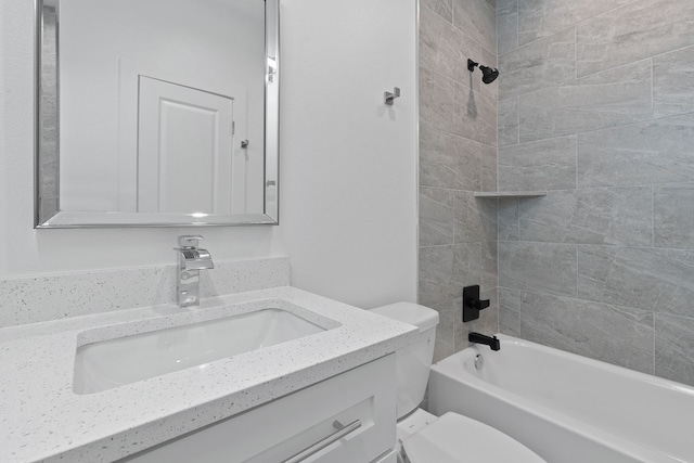 bathroom featuring toilet, shower / bathtub combination, and vanity