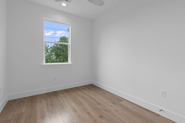 spare room featuring light hardwood / wood-style floors