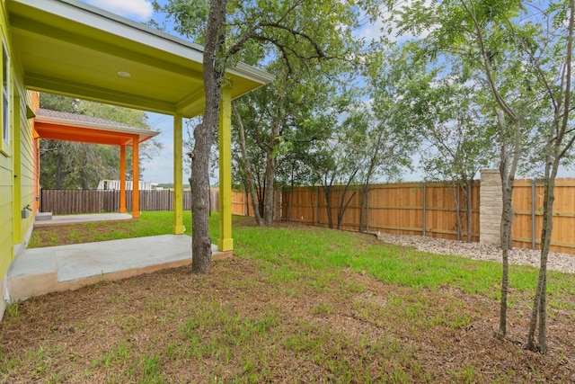 view of yard with a fenced backyard and a patio