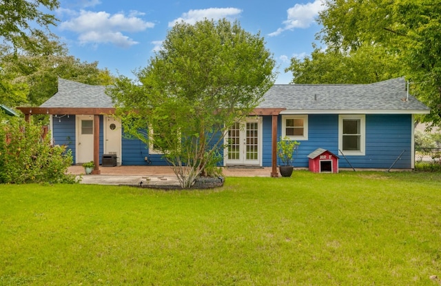 1511 Fairfield Dr, Austin, TX 78757 - back of house with french doors, a yard, and a shingled roof