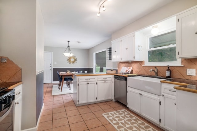 1511 Fairfield Dr, Austin, TX 78757 - kitchen featuring dishwasher, a sink, stove, and white cabinetry