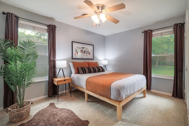 1511 Fairfield Dr, Austin, TX 78757 - bedroom with multiple windows, baseboards, and light carpet
