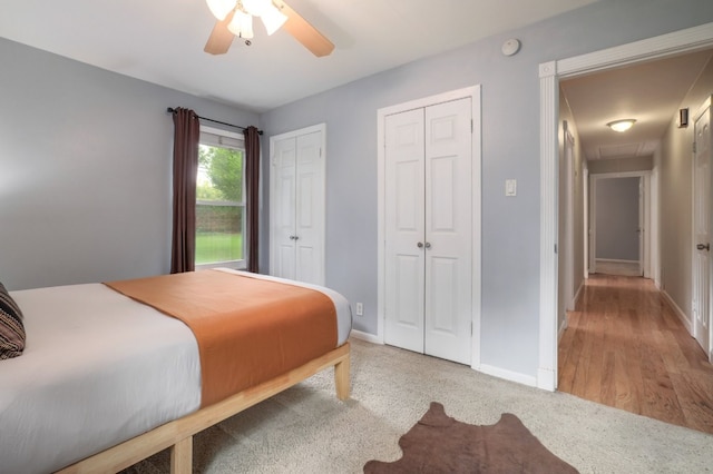1511 Fairfield Dr, Austin, TX 78757 - bedroom featuring two closets, baseboards, carpet flooring, ceiling fan, and attic access