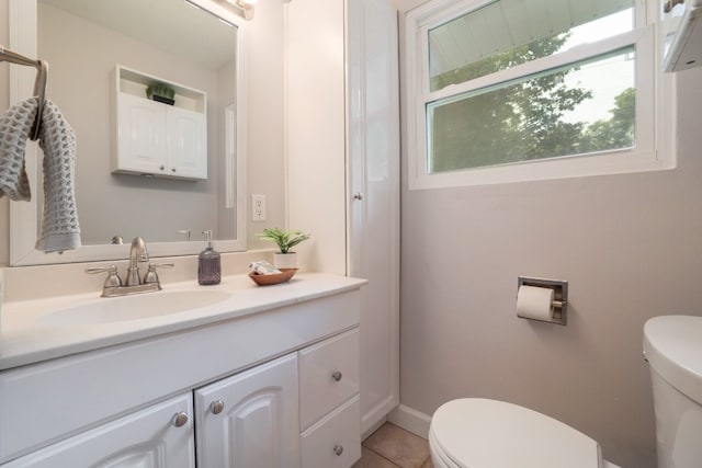 1511 Fairfield Dr, Austin, TX 78757 - half bath with toilet, vanity, tile patterned flooring, and baseboards