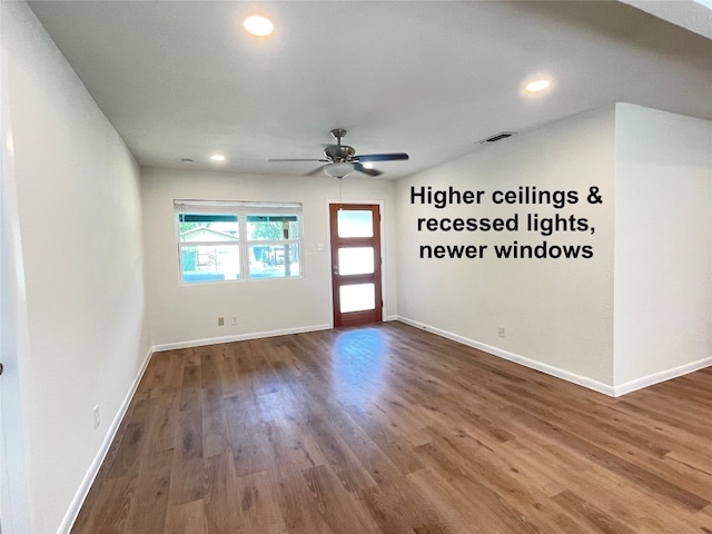 unfurnished room featuring hardwood / wood-style floors and ceiling fan