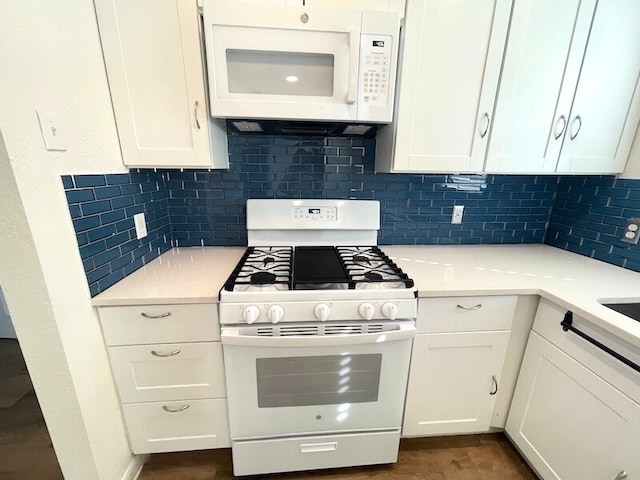 kitchen with white cabinetry, white appliances, and decorative backsplash