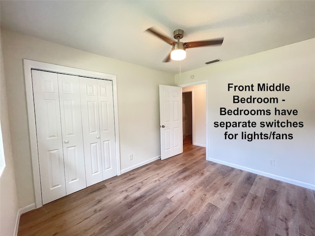 unfurnished bedroom with light hardwood / wood-style floors, ceiling fan, and a closet