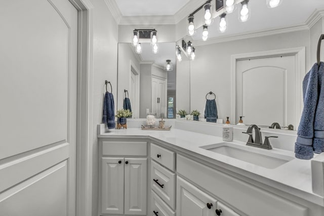 bathroom featuring vanity and ornamental molding