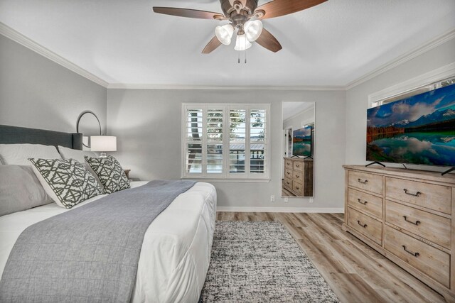 bedroom with ceiling fan, ornamental molding, and light wood-type flooring