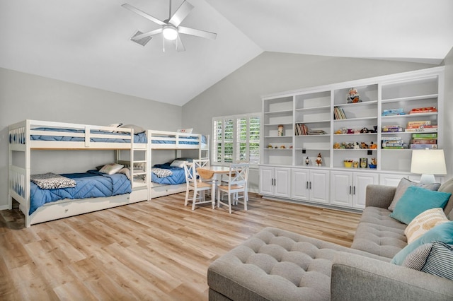 bedroom with light hardwood / wood-style flooring, ceiling fan, and high vaulted ceiling