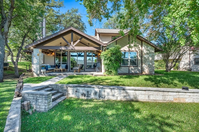 back of house with a yard, ceiling fan, and a patio area