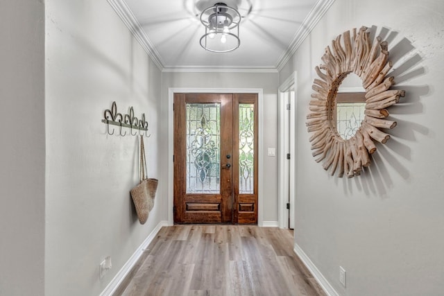 foyer with crown molding and light wood-type flooring