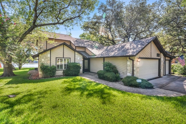 view of front of house with a front lawn and a garage