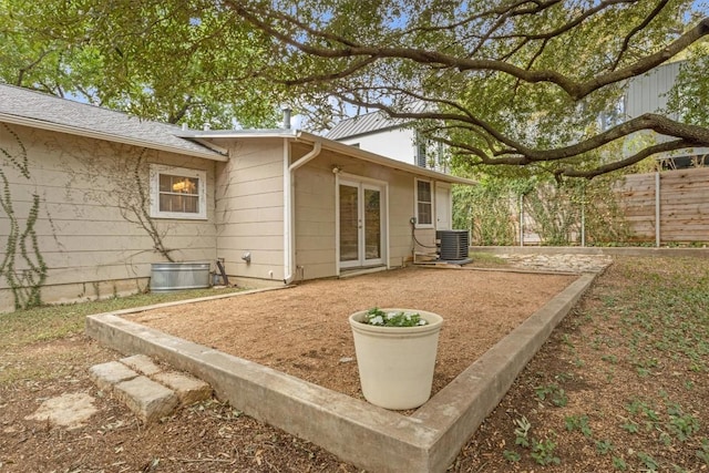 rear view of house featuring cooling unit