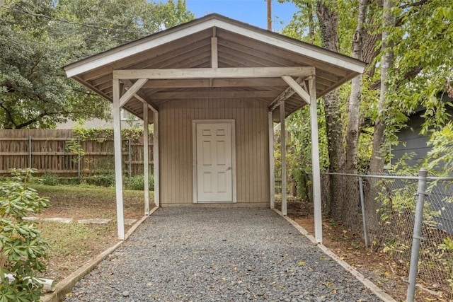 view of outbuilding with a carport