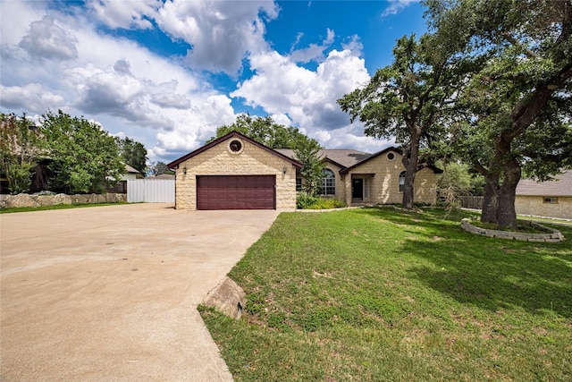 single story home featuring a front lawn, a garage, and an outdoor structure