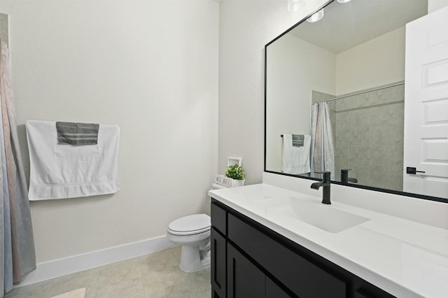 bathroom featuring tile patterned floors, a shower with curtain, toilet, and vanity