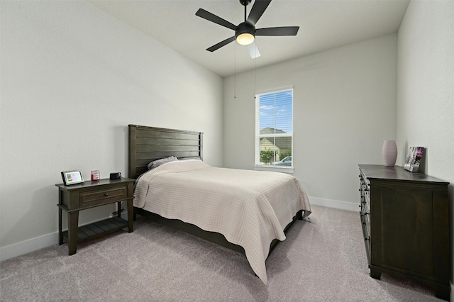 bedroom featuring light colored carpet and ceiling fan