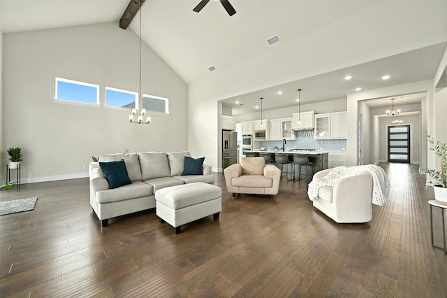 living room featuring ceiling fan with notable chandelier, high vaulted ceiling, dark hardwood / wood-style flooring, and beam ceiling