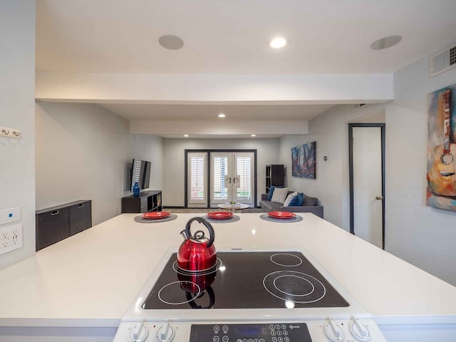 kitchen with black range and french doors