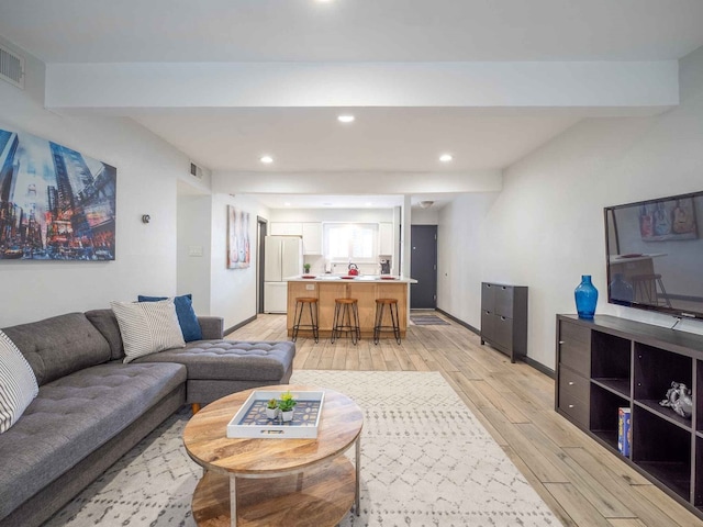 living room with light hardwood / wood-style floors