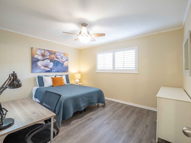 bedroom featuring ceiling fan, ornamental molding, and hardwood / wood-style floors