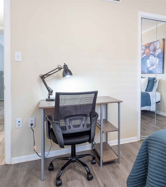 home office featuring hardwood / wood-style flooring