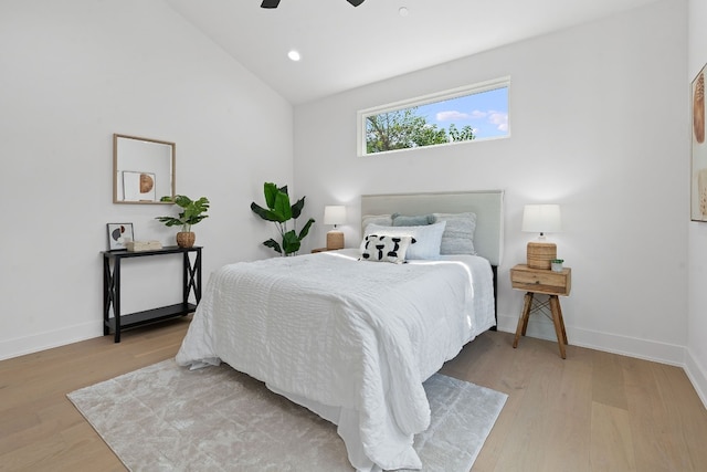 bedroom with light wood finished floors, recessed lighting, vaulted ceiling, ceiling fan, and baseboards