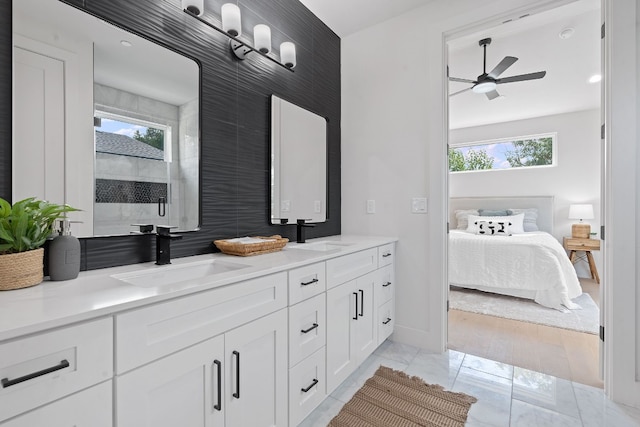 5511 William Holland Ave Unit 2, Austin, TX 78756 - ensuite bathroom with double vanity, healthy amount of natural light, ceiling fan, and marble finish floors
