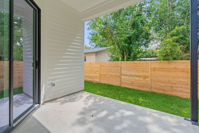 view of patio / terrace featuring fence