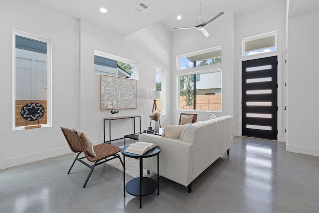 living room featuring recessed lighting, visible vents, concrete floors, and baseboards