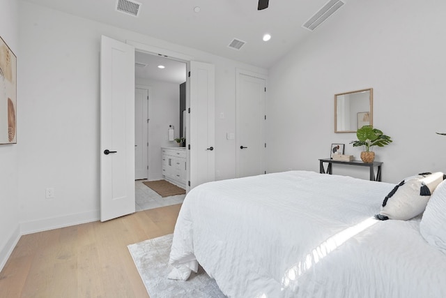 5511 William Holland Ave Unit 2, Austin, TX 78756 - bedroom with light wood finished floors, recessed lighting, lofted ceiling, ensuite bath, and ceiling fan